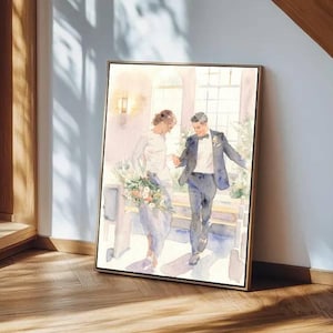 May include: Watercolor painting of a wedding scene. A couple is depicted walking together, the bride holding a bouquet. The artwork is framed in a gold-colored frame and leans against a wall. The painting has soft, pastel colors.