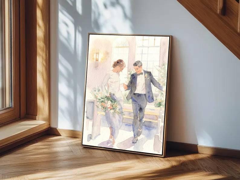 May include: Watercolor painting of a wedding scene. A couple is depicted walking together, the bride holding a bouquet. The artwork is framed in a gold-colored frame and leans against a wall. The painting has soft, pastel colors.