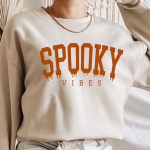 Spooky Vibes Halloween Sweatshirt: Retro Graphic Tee