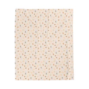 May include: A beige blanket with a repeating pattern of small, cartoon-style dogs and bones. The design features vertical stripes in a light brown colour. The dogs are in shades of brown and white.