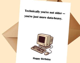 May include: A white greeting card with a brown envelope. The card features a retro computer illustration with the text "Technically you're not older - you're just more data-heavy." and "Happy Birthday."