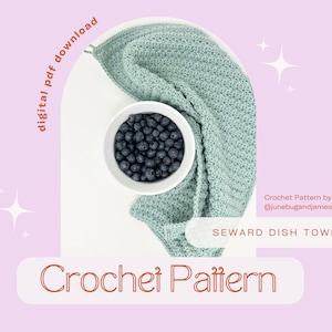 May include: A crochet dish towel pattern, called "Seward Dish Towel", in a light blue color. The pattern is by @junebugandjames. The image shows the towel draped over a bowl of blueberries.