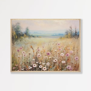 May include: A rectangular landscape painting in a wooden frame featuring a field of wildflowers in shades of pink, white, and yellow. The background shows a soft, hazy horizon with distant trees under a pale, muted sky, rendered in an impressionistic style.