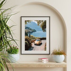 a painting of a car driving down a road