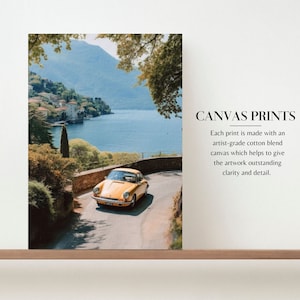 a yellow car driving down a road next to a lake