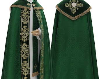 May include: Green liturgical cope with gold embroidery and a velvet collar. The cope has a fringe trim and a cross design on the back.
