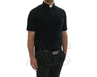 May include: A black short-sleeved collared shirt with a white collar and a single button closure. The shirt is worn with black pants and black shoes.