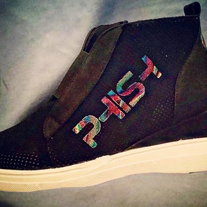The Wedge - Womens wedged canvas sneakers with vinyl “phish”on the outer sides and donut circles on the inner sides anf back.