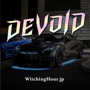 May include: A black sports car with blue underglow lights and a holographic sticker that says "DEVOID" on the front. The car is parked in front of a building with the text "WitchingHour.jp" on the ground.