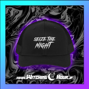 May include: Black trucker hat with the text "Seize the Night" in white, stylized lettering. The hat has a mesh back and a curved brim. The website "www.Witching Hour.jp" is printed at the bottom.