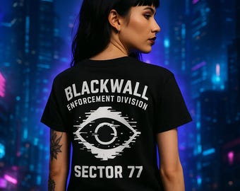 May include: Black t-shirt with white text reading "BLACKWALL ENFORCEMENT DIVISION" and "SECTOR 77". The shirt displays a white eye graphic. The background is a blurred cityscape with neon lights.