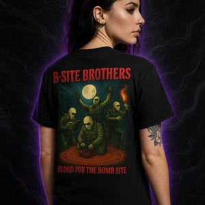 May include: Black t-shirt with the text "B-SITE BROTHERS" in red. The back of the shirt features a graphic of four figures in green jumpsuits and masks, with a full moon in the background. The text "BLOOD FOR THE BOMB SITE" is below the graphic.