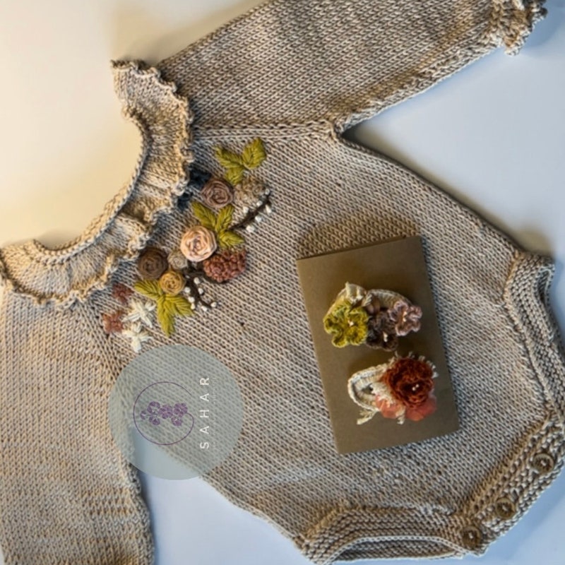 Birinit Petit Baby Knit romper with floral embroidery
