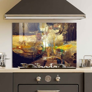 May include: Abstract art kitchen backsplash with a mix of brown, gold, yellow, and green paint colors. The backsplash is made of tempered glass and is designed to protect the wall behind a stove.