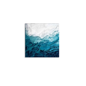 May include: Abstract painting of a blue ocean with white foam at the top. The painting has a textured look, like water.