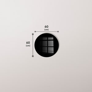 May include: A black round mirror with a window reflection. The mirror is 60 inches in diameter.