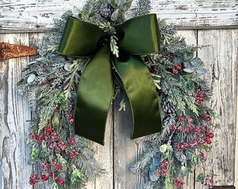Winter farmhouse frosted pine and berry door swag, red berry pine swag, winter horse shoe shaped frosted pine wreath, winter door swag