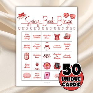 May include: A white card with red text and illustrations for a game called "Spicy Book Bingo." The card features bingo squares with romantic themes like "Billionaire Romance" and "Enemies to Lovers." The card also states "50 Unique Cards."