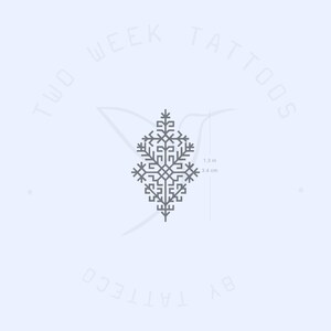 May include: A gray geometric design tattoo, resembling a stylized tree, with the text "Two Week Tattoos" and "By Tattoo Co." around the design. The design measures 1.3 inches or 3.4 centimeters.