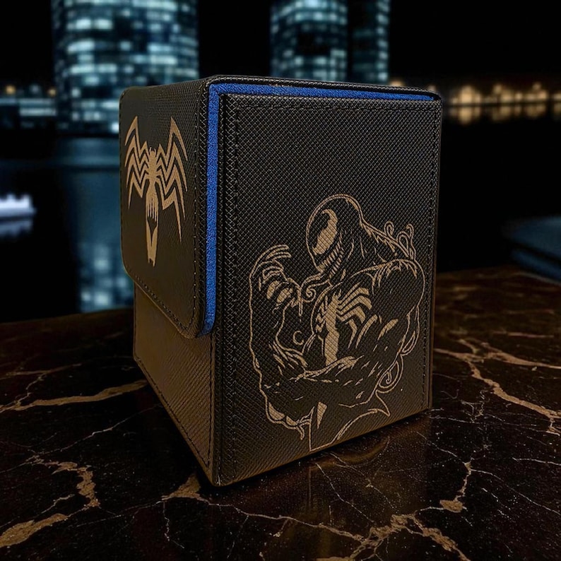 A black and blue storage box with a design featuring a spider-like creature, likely inspired by the Marvel superhero Spider-Man.