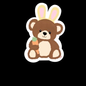 May include: A brown teddy bear sticker wearing bunny ears and holding a carrot. The bear has a cream-colored belly and a black nose and eyes. The bunny ears are yellow with pink inner ears. The sticker is on a white background.
