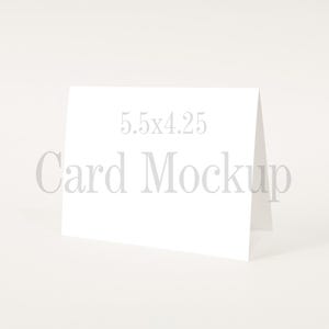 May include: A blank white card mockup, standing upright on a white surface. The card measures 5.5 x 4.25 inches.