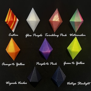 May include: Ten different colour-changing dice with names like "Glow Purple", "Twinkling Pink", "Watermelon", "Orange to Yellow", "Purple to Pink", "Green to Yellow", "Wizards Voodoo", and "Vertigo Starlight".