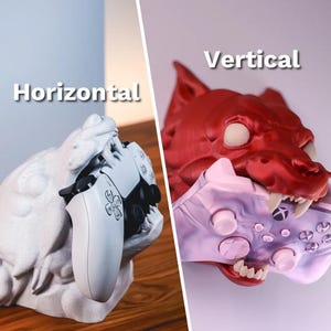 May include: Two 3D printed game controller holders, one in the shape of a wolf's head and the other in the shape of a dragon's head. The wolf's head is red and the dragon's head is white. The wolf's head is holding a purple and pink game controller vertically, while the dragon's head is holding a white game controller horizontally. The text "Vertical" is above the wolf's head and the text "Horizontal" is above the dragon's head.