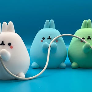 Soporte para cables con forma de conejito
