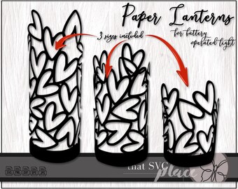 May include: Three black paper lantern designs with a heart pattern. The lanterns are for battery operated lights. The text "Paper Lanterns" and "3 sizes included" is visible in the image.