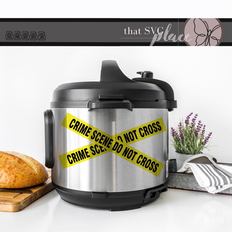 May include: A silver Instant Pot with a black lid and handle. Yellow caution tape is wrapped around the pot with the text "CRIME SCENE DO NOT CROSS" printed on it.