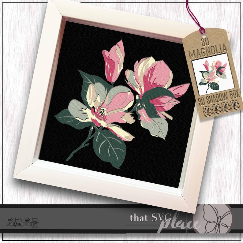May include: A framed floral art piece featuring a 3D magnolia design. The artwork showcases pink and cream-colored magnolia blossoms with green leaves against a black background. The frame is white, and a tag reads "3D Magnolia".