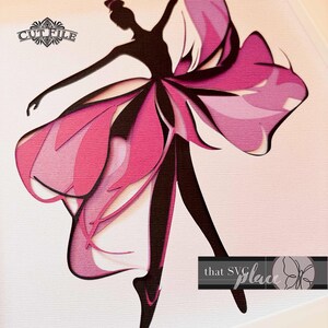 May include: A pink and white layered paper cut design of a ballerina with a flowing skirt. The design is intricate and detailed, with a delicate silhouette of the ballerina. The background is a light pink.
