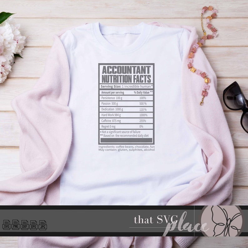 May include: A white t-shirt with a gray graphic of a nutrition facts label for an accountant. The label lists the daily value of persistence, passion, dedication, hard work, caffeine, and regret. The text reads "Accountant Nutrition Facts".