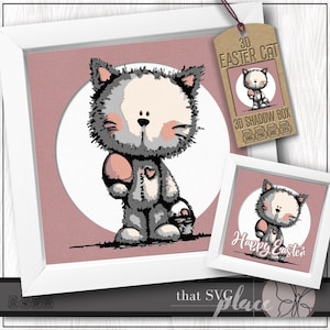 Peut inclure: Impression encadrée d'un chat de dessin animé gris et blanc tenant un œuf de Pâques rose et un panier. Le chat est placé sur un fond rose avec un cercle blanc. Une petite impression encadrée et une étiquette avec le texte "3D Easter Cat" sont également visibles.