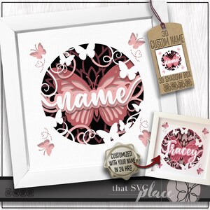 Può includere: Una scatola ombra 3D incorniciata con un design a farfalla. Il design presenta una farfalla rosa e nera con la parola "name" in corsivo bianco. L'immagine include il testo "CUSTOMIZED WITH YOUR NAME IN 24 HRS" e "3D CUSTOM NAME".