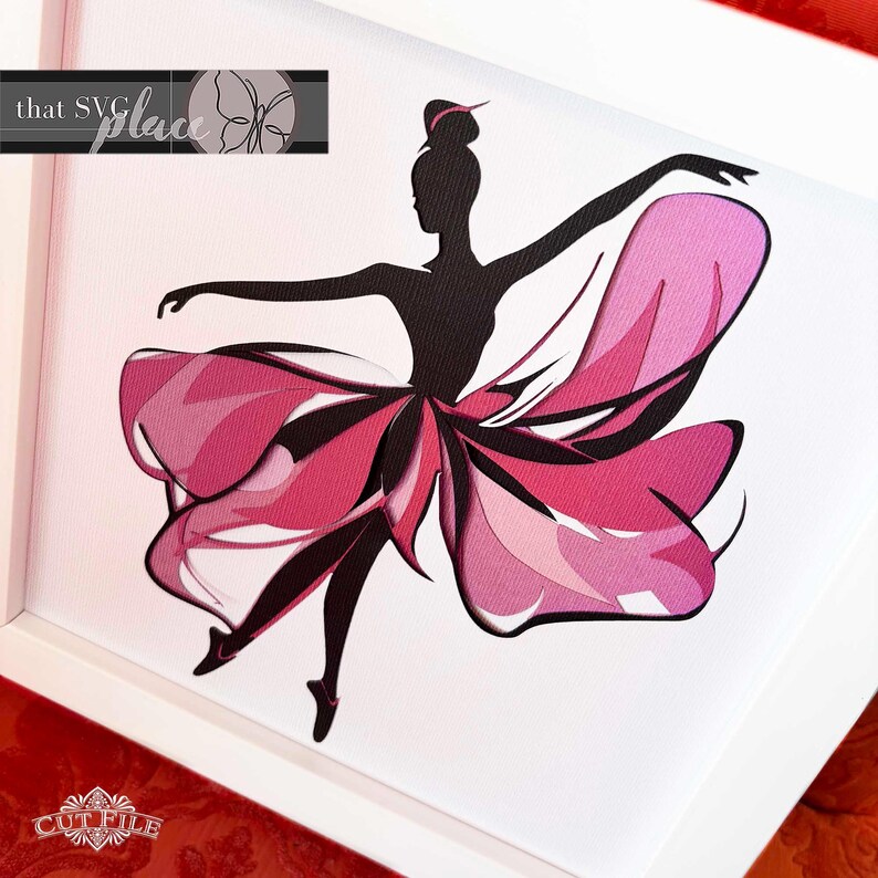 May include: A black silhouette of a ballerina with a pink and white layered tutu. The ballerina is in a dancing pose with her arms outstretched.