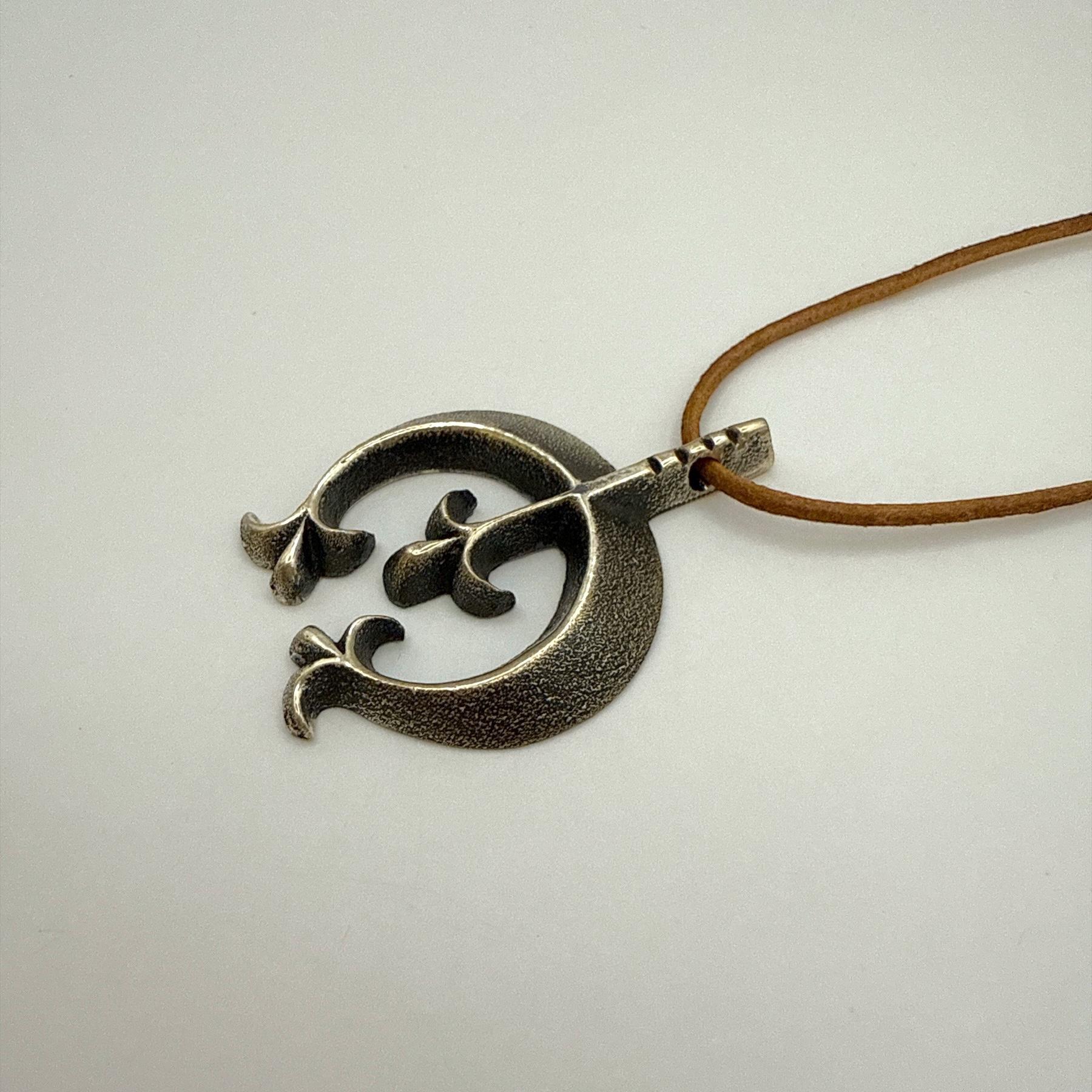 Tufa Cast Sterling Silver Naja Pendant by Aaron Anderson, Navajo