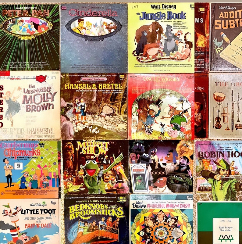 May include: A collection of vintage vinyl records featuring classic Disney characters and stories, including Peter Pan, Cinderella, The Jungle Book, The Unsinkable Molly Brown, Hansel and Gretel, Uncle Wiggly, The Muppet Show, Robin Hood, Bedknobs and Broomsticks, and The Wonderful World of Color. The records are in various colours and feature illustrations of the characters.