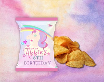 May include: Pink and white chip bag with a unicorn and rainbow design. The bag says "Abbie's 6th Birthday".