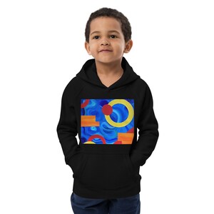 May include: Black kids' hoodie with a colourful abstract design featuring circles, squares, and swirls in shades of blue, red, yellow, and orange.