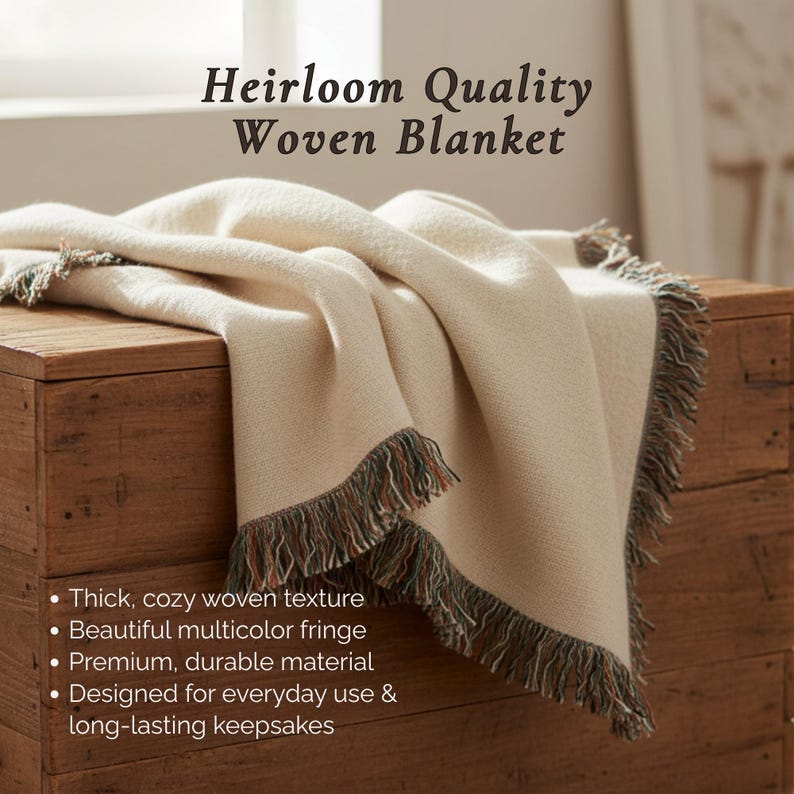 May include: Cream-colored woven blanket with a thick, cozy texture and a multicolor fringe. The blanket is draped over a wooden chest. Text on the image reads "Heirloom Quality Woven Blanket."