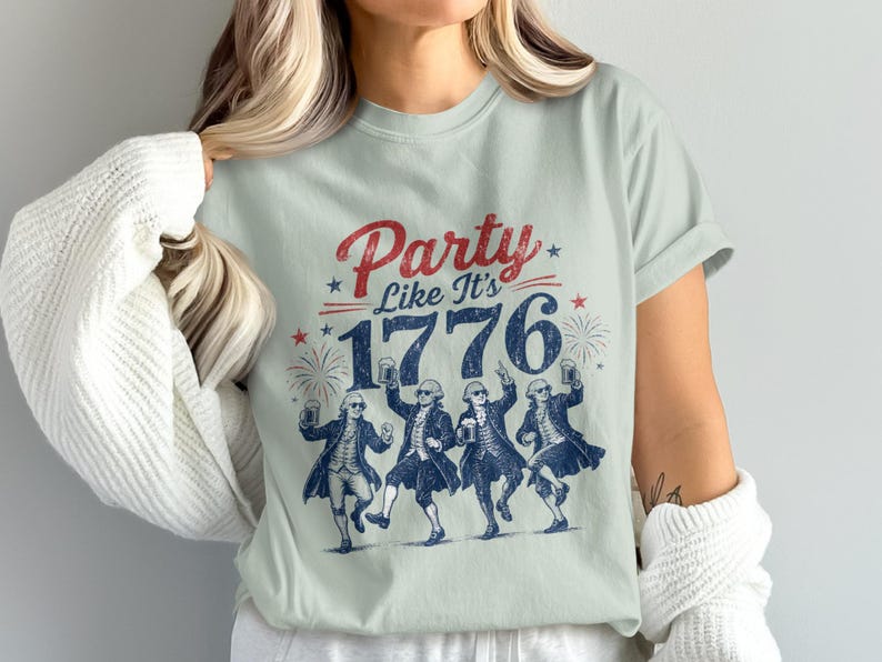 T-shirt with "Party Like It's 1776" and dancing historical figures holding mugs.