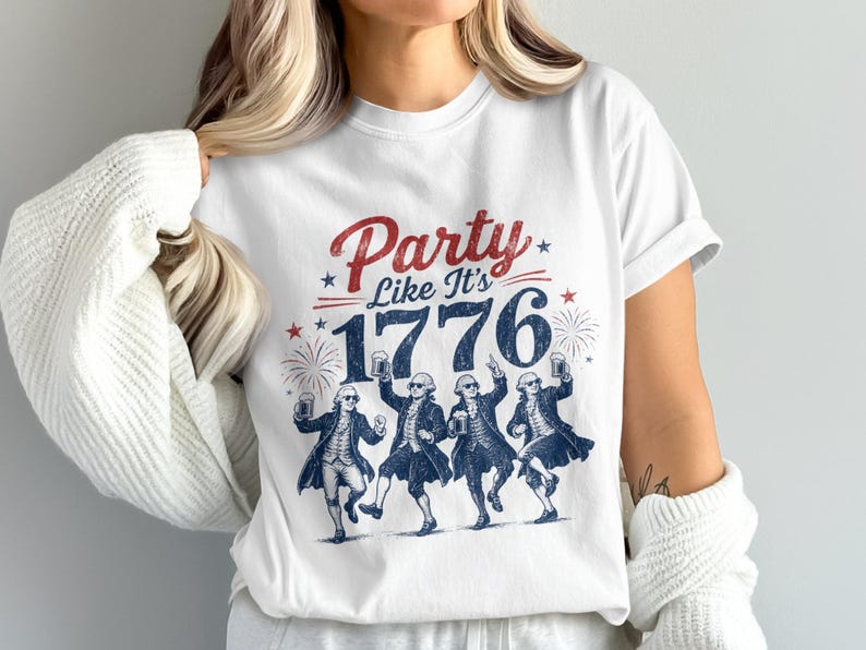 White t-shirt with "Party Like It's 1776" and dancing Founding Fathers graphic.