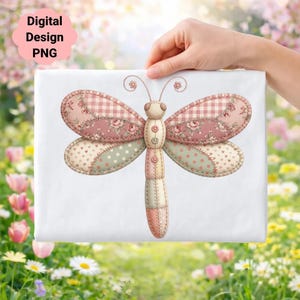 May include: A digital design PNG of a dragonfly with patchwork wings. The wings feature floral, polka dot, and gingham patterns in pink, green, and cream. The dragonfly's body is cream and pink with button details.
