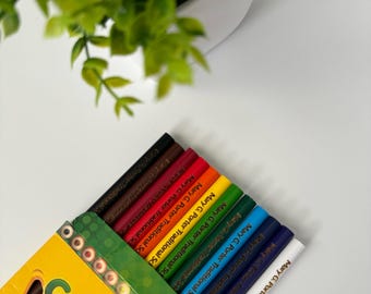 May include: A box of Crayola crayons with the text "Mary G. Porter Traditional School" printed on each crayon. The box is yellow with green accents and the Crayola logo.
