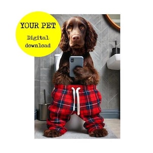 May include: A brown dog wearing red and black plaid pajama pants sits on a white toilet seat and holds a smartphone in its paws. The dog is looking at the phone. The text "YOUR PET Digital download" is in a yellow circle in the upper left corner of the image.