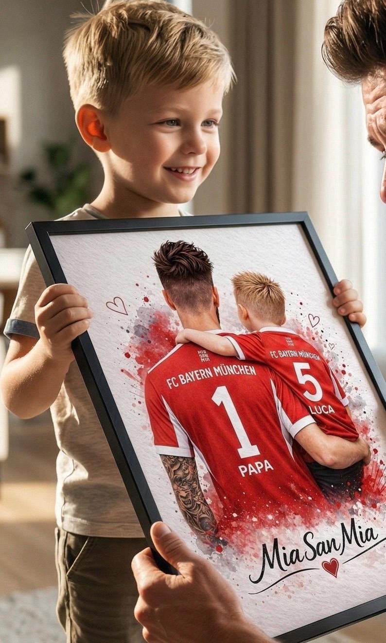 May include: A framed print featuring a watercolor-style illustration of two people in FC Bayern M&uuml;nchen jerseys. The jersey numbers are 1 and 5, with the names "PAPA" and "LUCA" below. The text "Mia San Mia" is also visible.