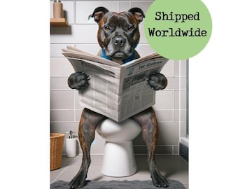 May include: A black and brown dog wearing a blue bandana sits on a white toilet seat and reads a newspaper. The dog is in a bathroom with white tiled walls.