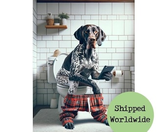 May include: A black and white dog wearing red and black plaid pajamas sits on a white toilet in a bathroom with white tile walls. The dog is holding a smartphone in its paws.